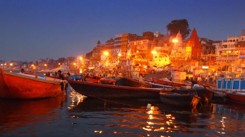 Prayagraj, Varanasi, air quality, NCAP, pollution control, clean air, Indian cities, urban environment, environmental success, Miyawaki forests, PM10 reduction, PM2.5 reduction, electric buses, smog guns, community involvement, CPCB, air pollution India